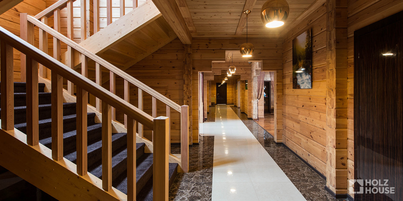 Перепланировка в доме из клееного бруса: можно ли сносить стены?